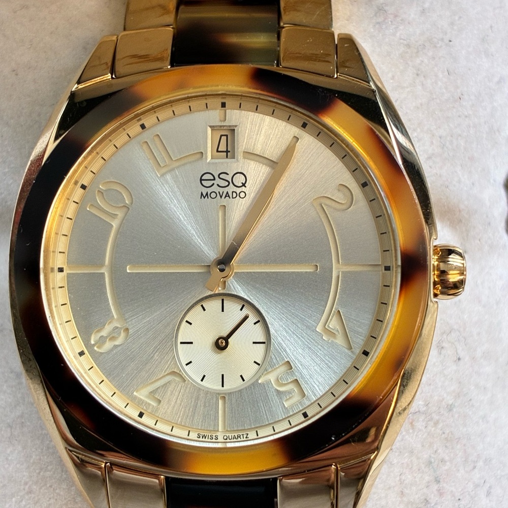 Movado ESQ Women's Gold Tone Watch with Tortoiseshell Bezel and Silver Dial
